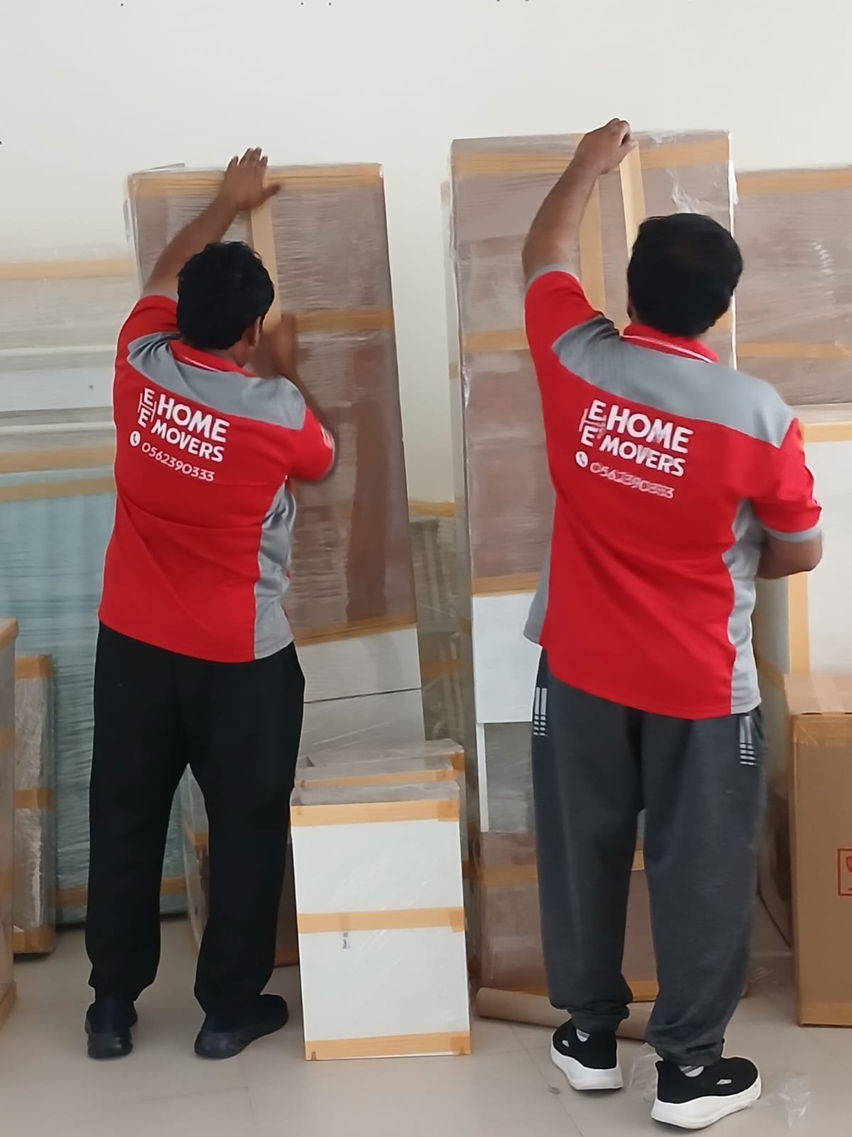 Movers discussing a moving plan in Dubai