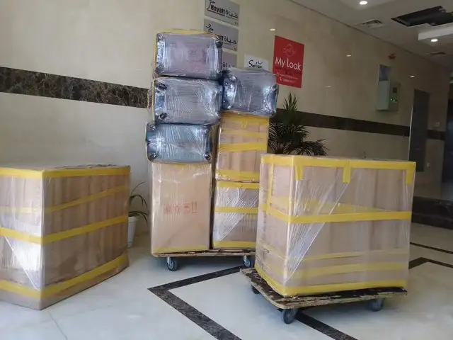 Villa movers and packers in Dubai loading furniture for a multi-room relocation